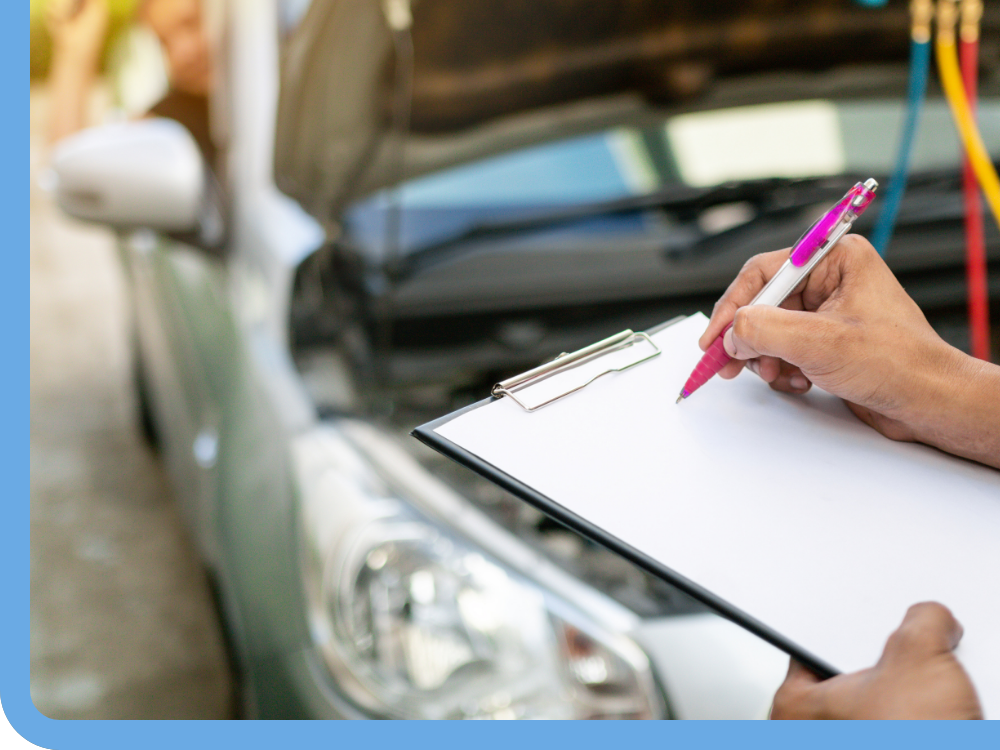 mechanic writing on clipboard