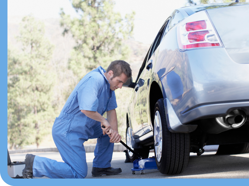 mobile mechanic changing tire