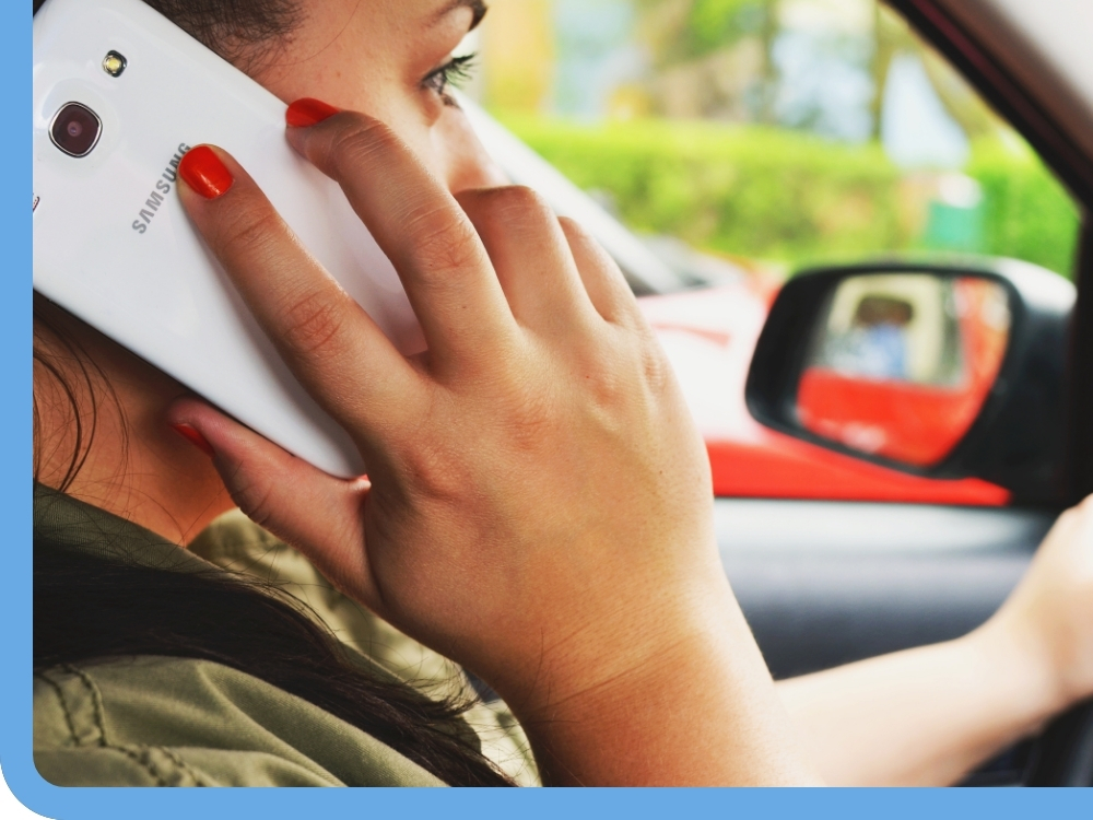 Woman on the phone while in a car